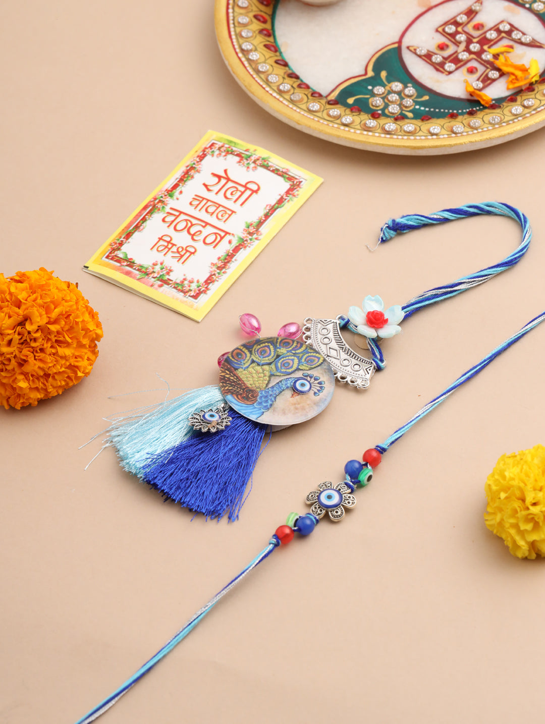 NVR Set of 2 Blue Evil Eye & Peacock Design Artificial Beads Bhaiya Bhabhi Rakhi With Roli Chawal Chandan & Mishri | Grocsy