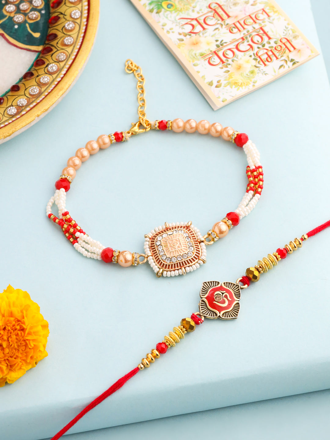 NVR Set of 2 Gold Toned Artificial Stones & Beads Om Design Bhaiya Bhabhi Rakhi with Roli Chawal Chandan & Mishri | Grocsy