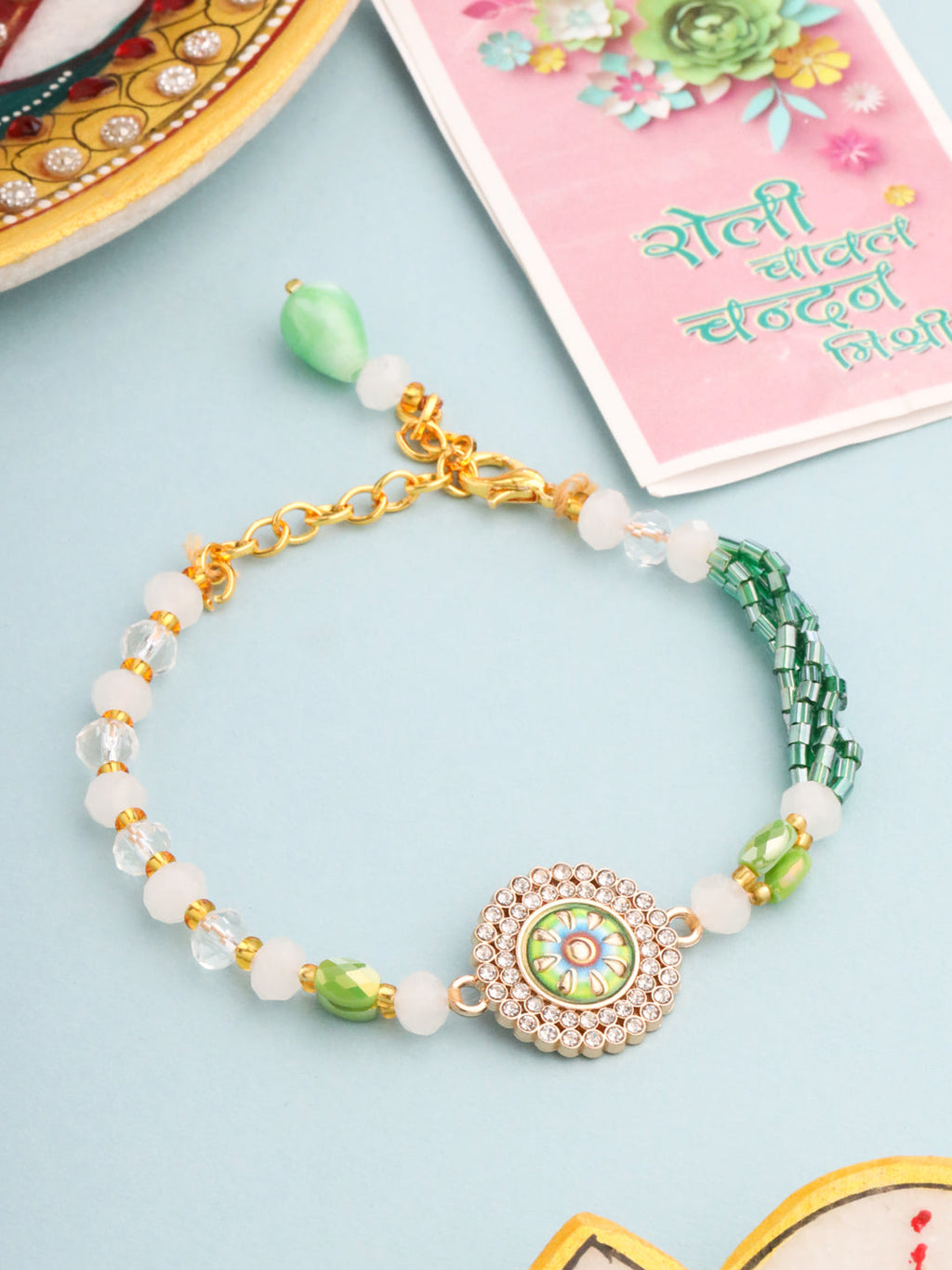 NVR Women Green Artificial Stones & Beads Floral Wraparound Rakhi with Roli Chawal Chandan & Mishri | Grocsy