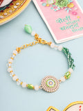 NVR Women Green Artificial Stones & Beads Floral Wraparound Rakhi with Roli Chawal Chandan & Mishri | Grocsy