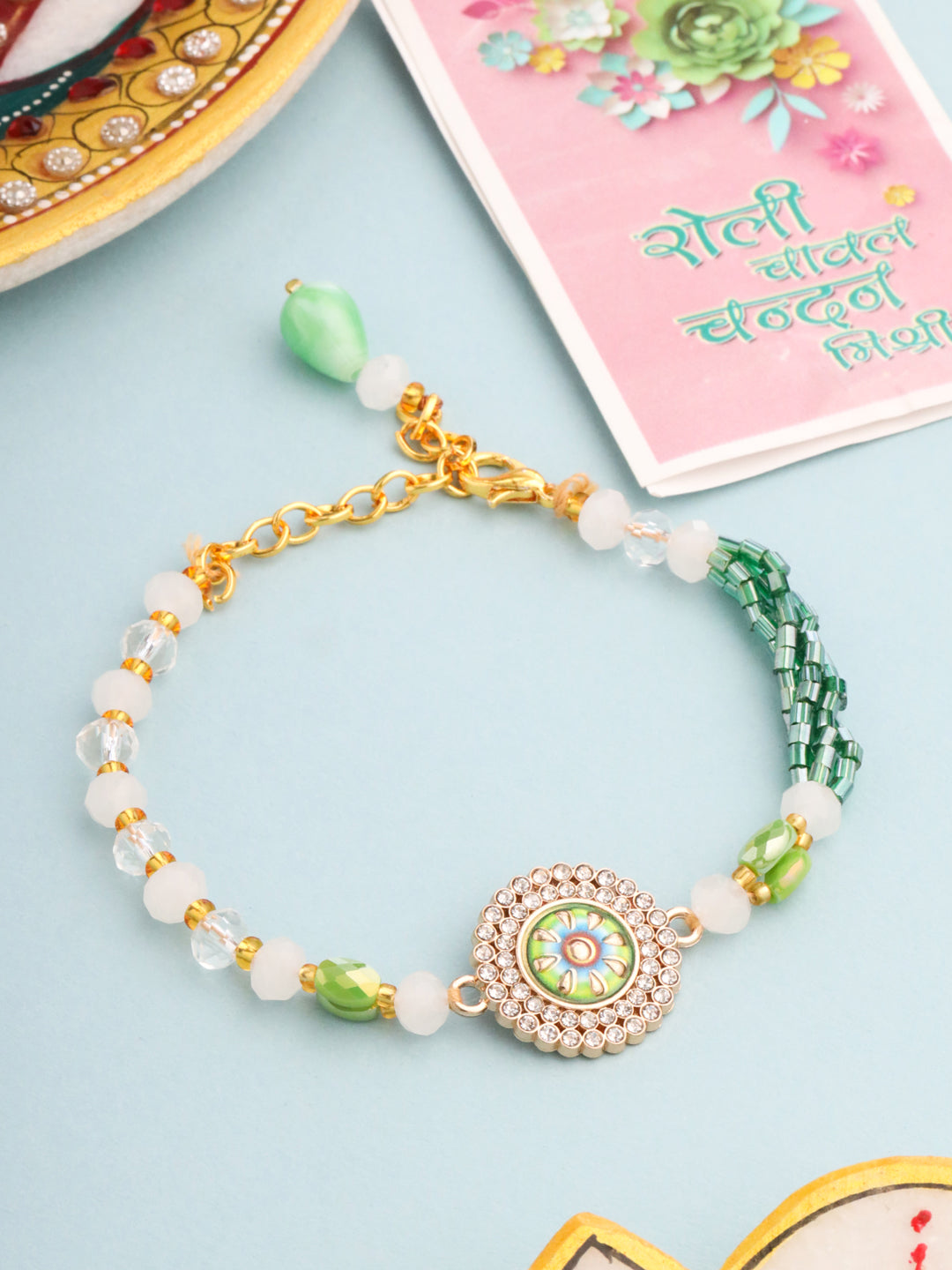 NVR Women Green Artificial Stones & Beads Floral Wraparound Rakhi with Roli Chawal Chandan & Mishri | Grocsy
