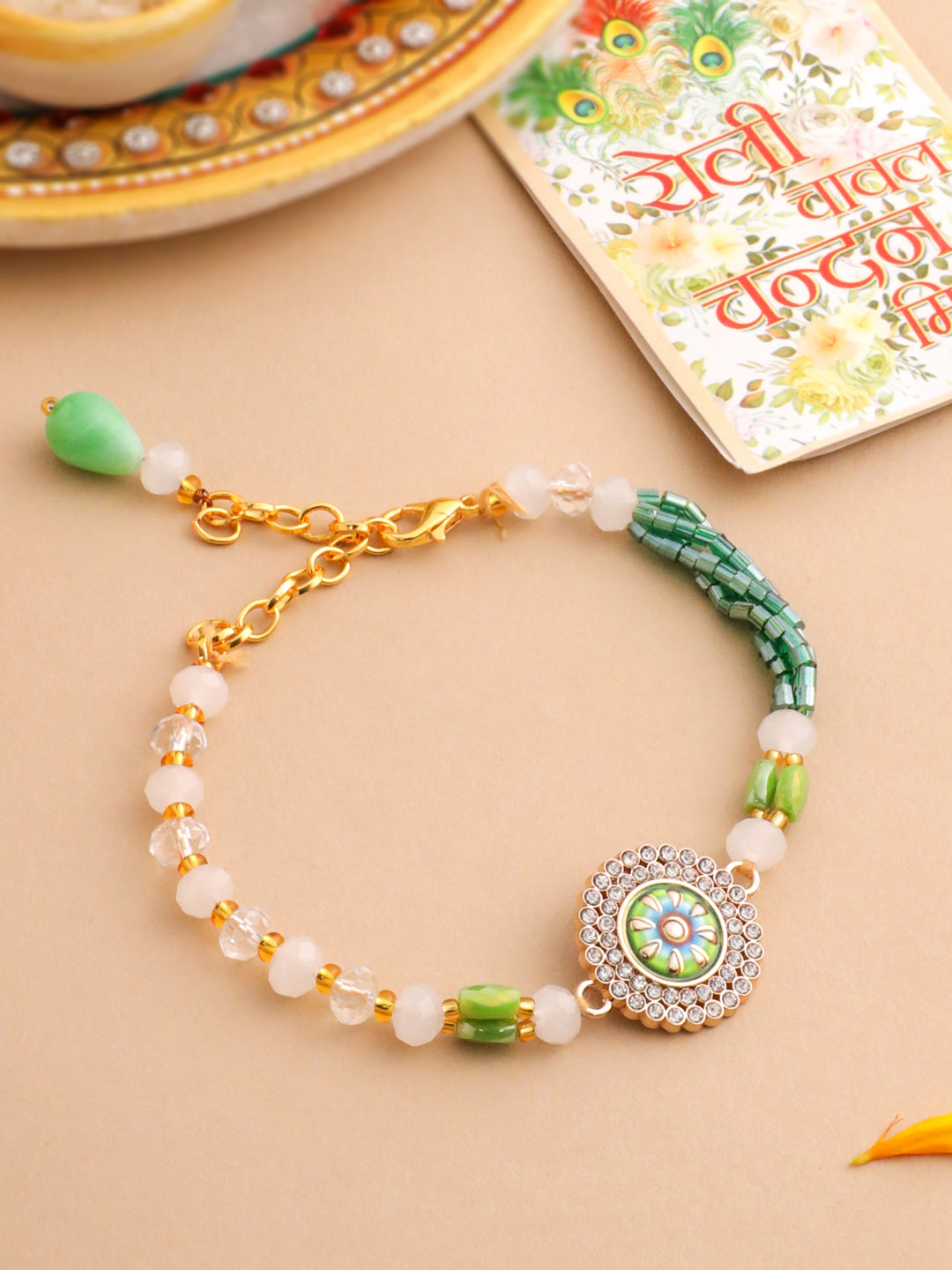 NVR Women Green Artificial Stones & Beads Floral Wraparound Rakhi with Roli Chawal Chandan & Mishri | Grocsy