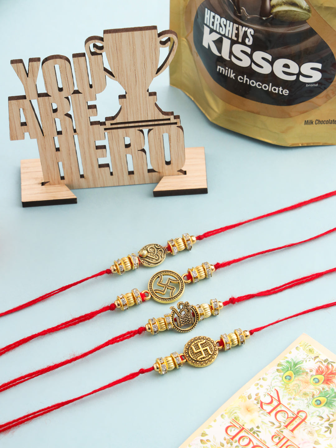 NVR Men Set of 4 Gold Toned Artificial Stones Swastik Design Thread Rakhi Combo | Grocsy