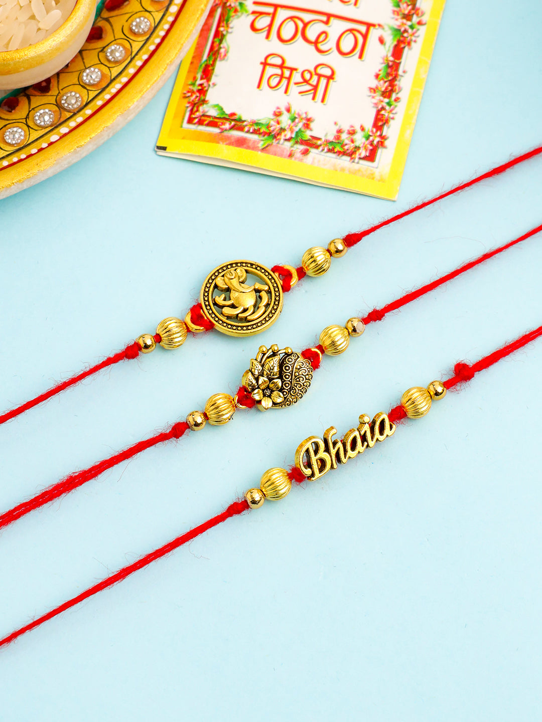 NVR Men Set of 3 Gold Toned Thread Rakhi with Roli Chawal Chandan & Mishri | Grocsy