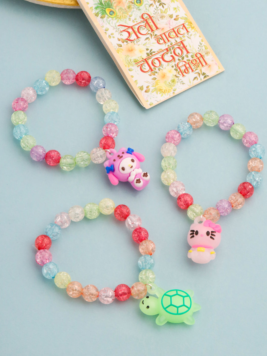NVR Kids Set of 3 Cartoon Design Artificial Beads Thread Rakhi with Roli Chawal Chandan & Mishri | Grocsy