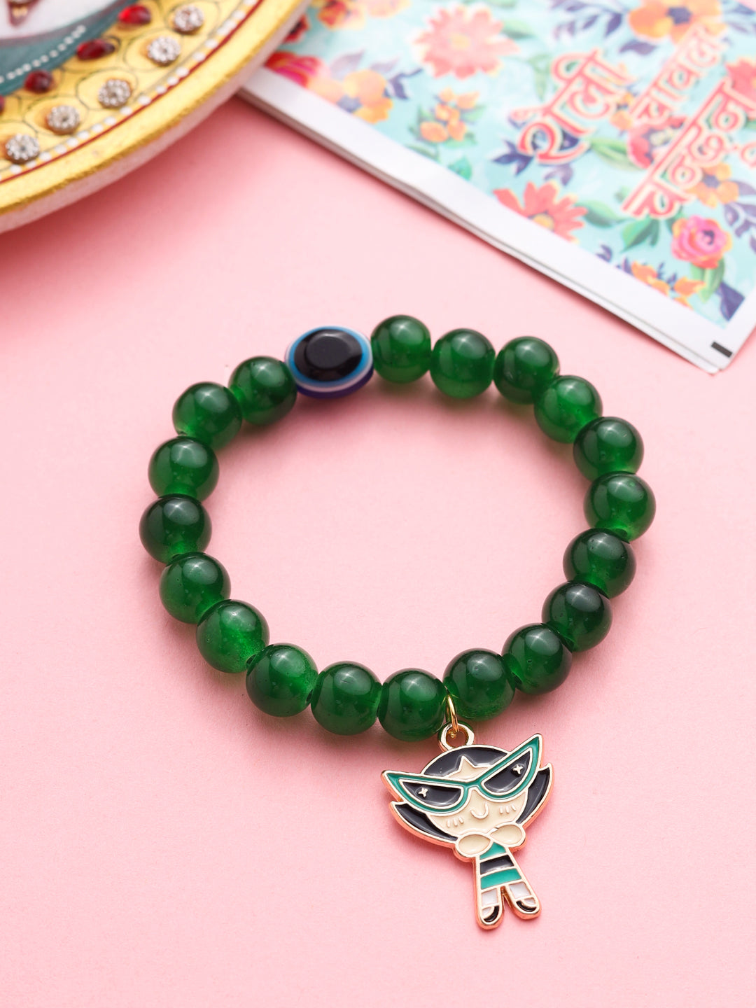 NVR Kids Cartoon Design Green Artificial Beads Thread Rakhi with Roli Chawal Chandan & Mishri | Grocsy