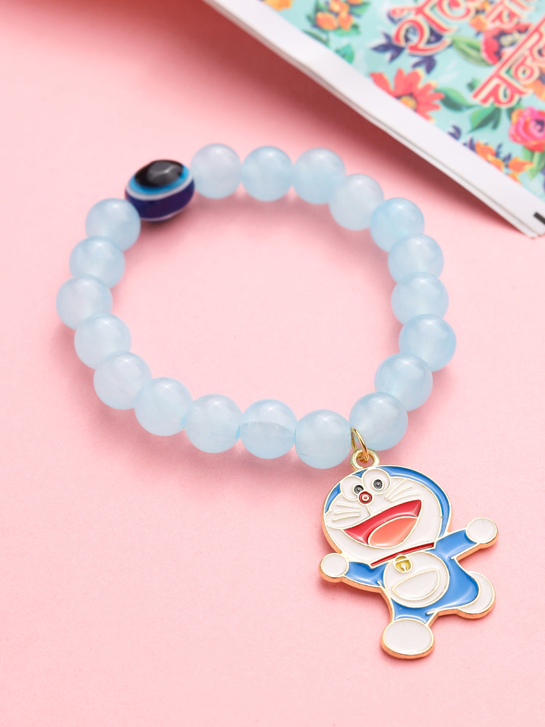 NVR Kids Cartoon Design Sky BLue Artificial Beads Thread Rakhi with Roli Chawal Chandan & Mishri | Grocsy