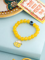 NVR Kids Cartoon Design Yellow Artificial Beads Thread Rakhi with Roli Chawal Chandan & Mishri | Grocsy