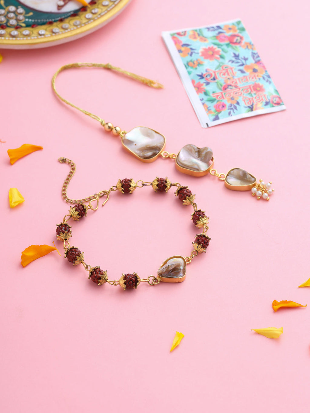 NVR Set of 2 Gold Toned Rudraksh & Pearls Bhaiya Bhabhi Rakhi with Roli Chawal Chandan & Mishri | Grocsy