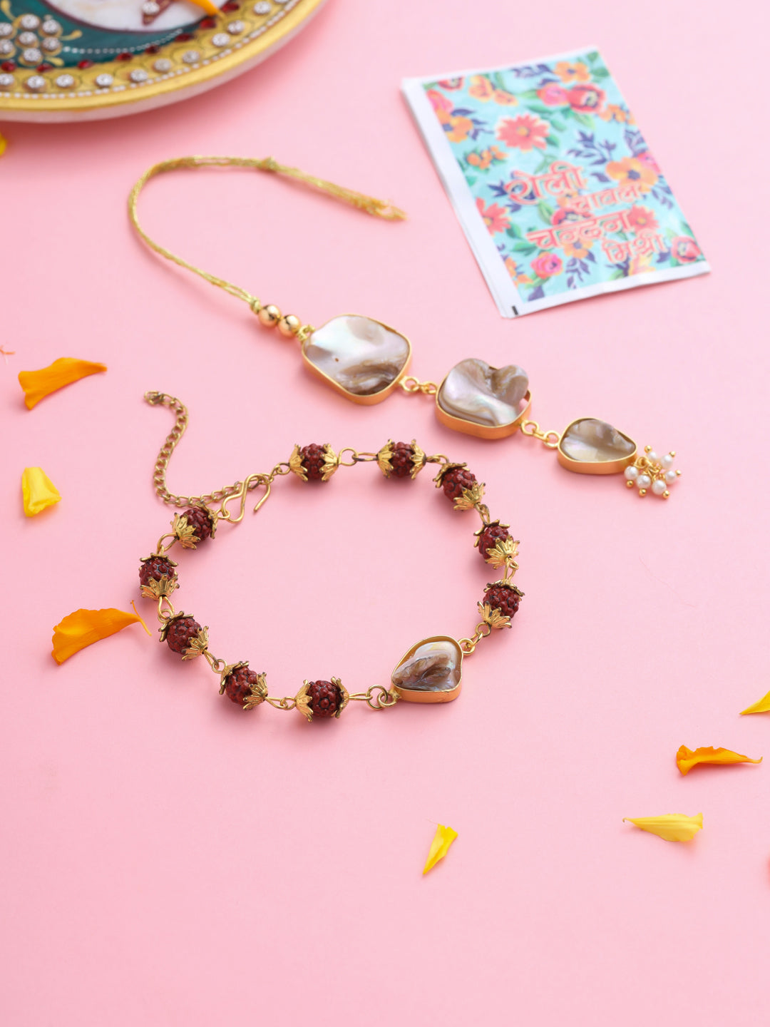 NVR Set of 2 Gold Toned Rudraksh & Pearls Bhaiya Bhabhi Rakhi with Roli Chawal Chandan & Mishri | Grocsy