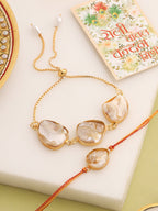 NVR Set of 2 Gold Toned Pearls Bhaiya Bhabhi Rakhi with Roli Chawal Chandan & Mishri | Grocsy