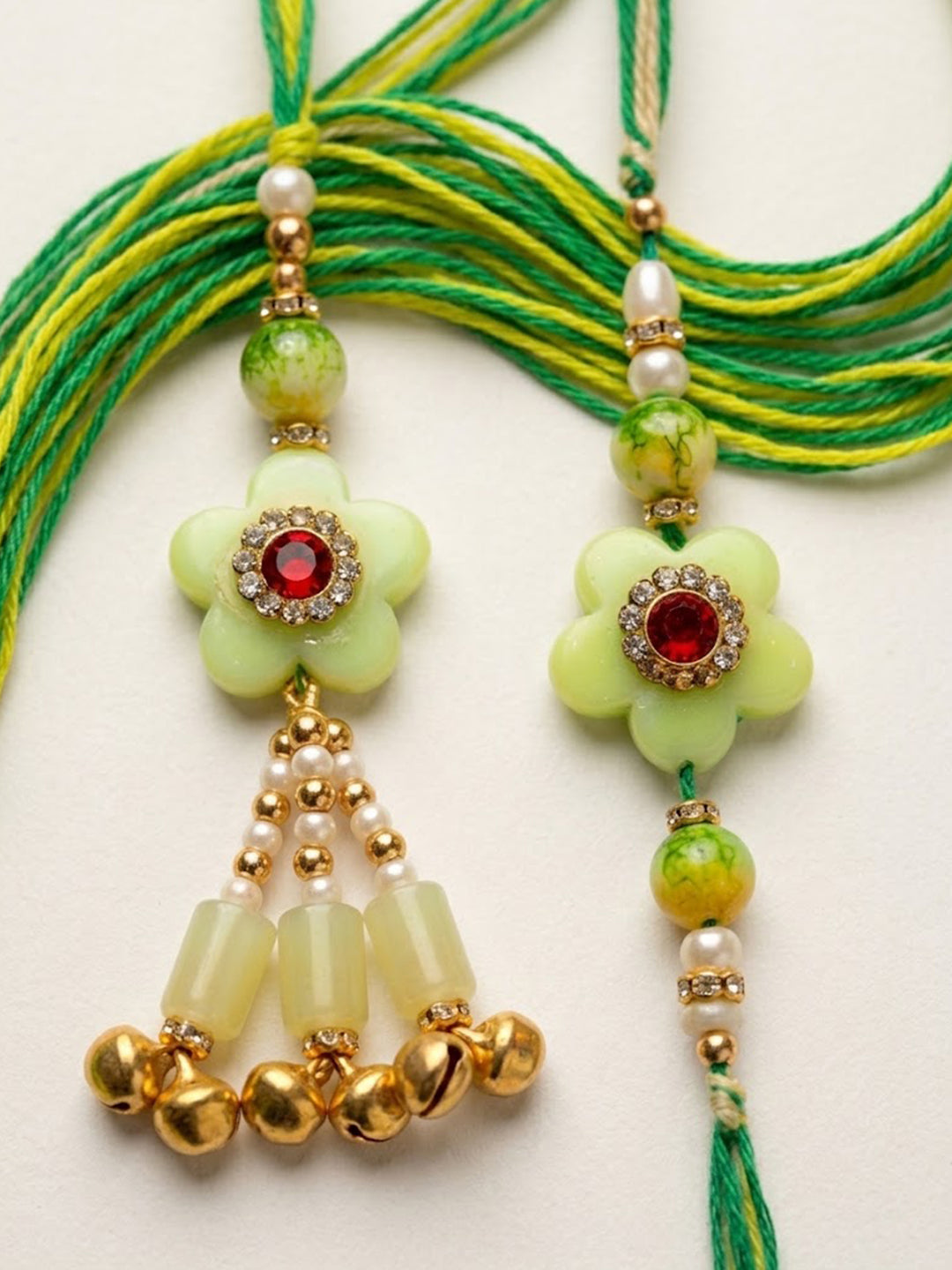 NVR Set of 2 Flower Shape Artificial Stones & Beads Bhaiya Bhabhi Rakhi With Roli Chawal | Grocsy