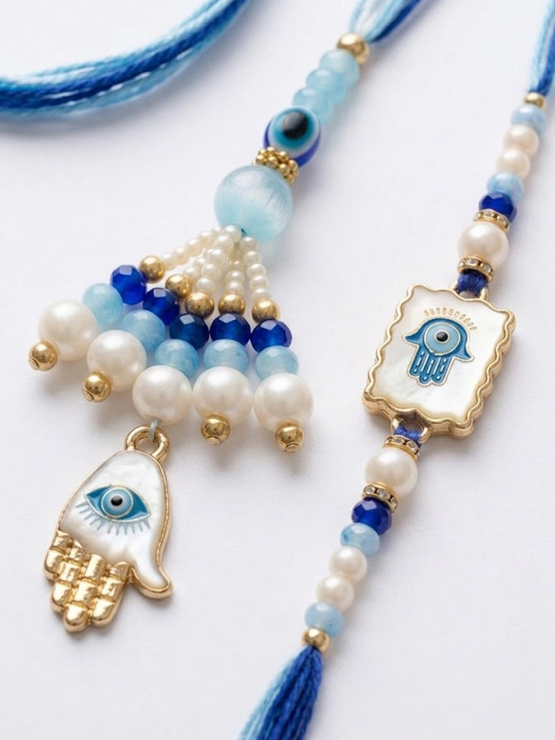 NVR Set of 2 Evil Eye Hand Design Bhaiya Bhabhi Rakhi with Roli Chawal Chandan Mishri | Grocsy