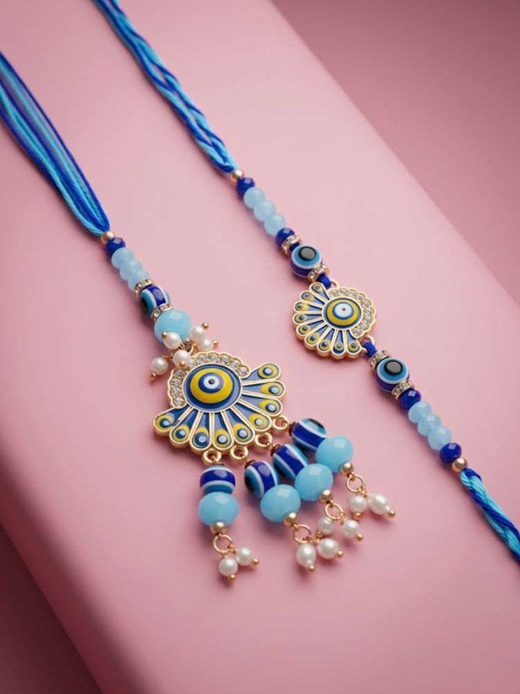 NVR Set of 2 Blue Evil Eye Artificial Beads Bhaiya Bhabhi Rakhi With Roli Chawal | Grocsy