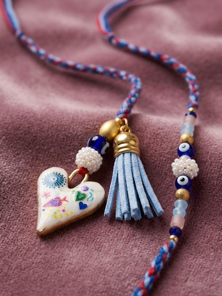 NVR Set of 2 Evil Eye Beaded Heart Shape Bhaiya Bhabhi Rakhi with Roli Chawal Chandan | Grocsy