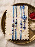 NVR Set of 4 Designer Blue Evil Eye Thread Rakhi with Roli Chawal Chandan Mishri | Grocsy