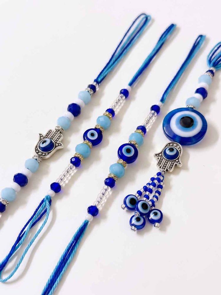 NVR Set of 4 Designer Blue Evil Eye Thread Rakhi with Roli Chawal Chandan Mishri | Grocsy