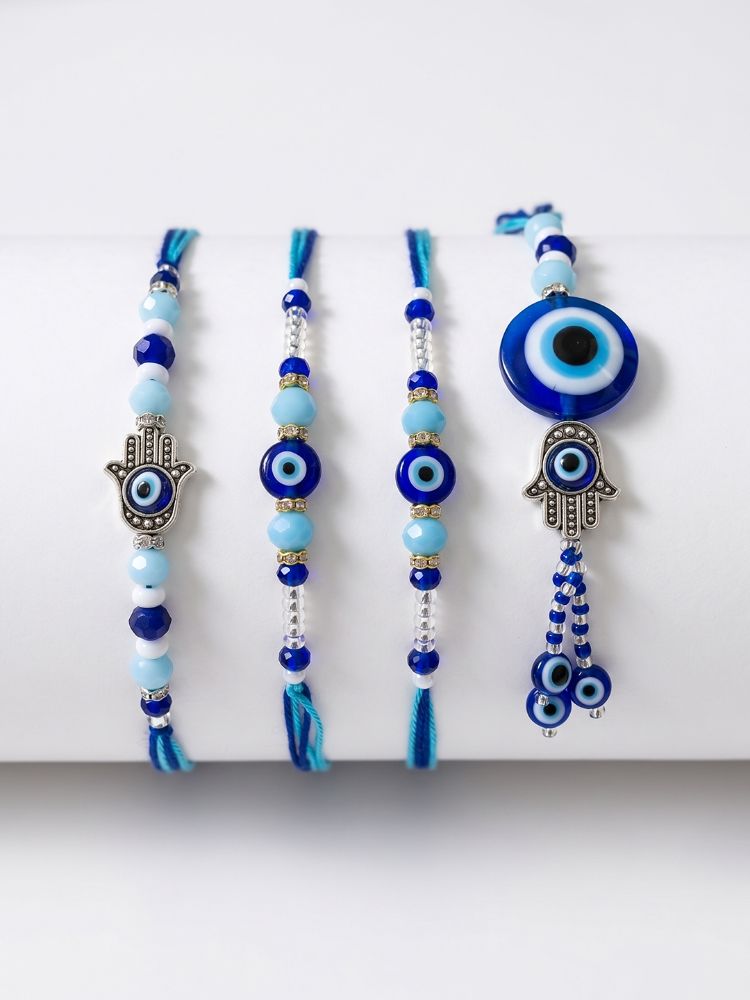NVR Set of 4 Designer Blue Evil Eye Thread Rakhi with Roli Chawal Chandan Mishri | Grocsy