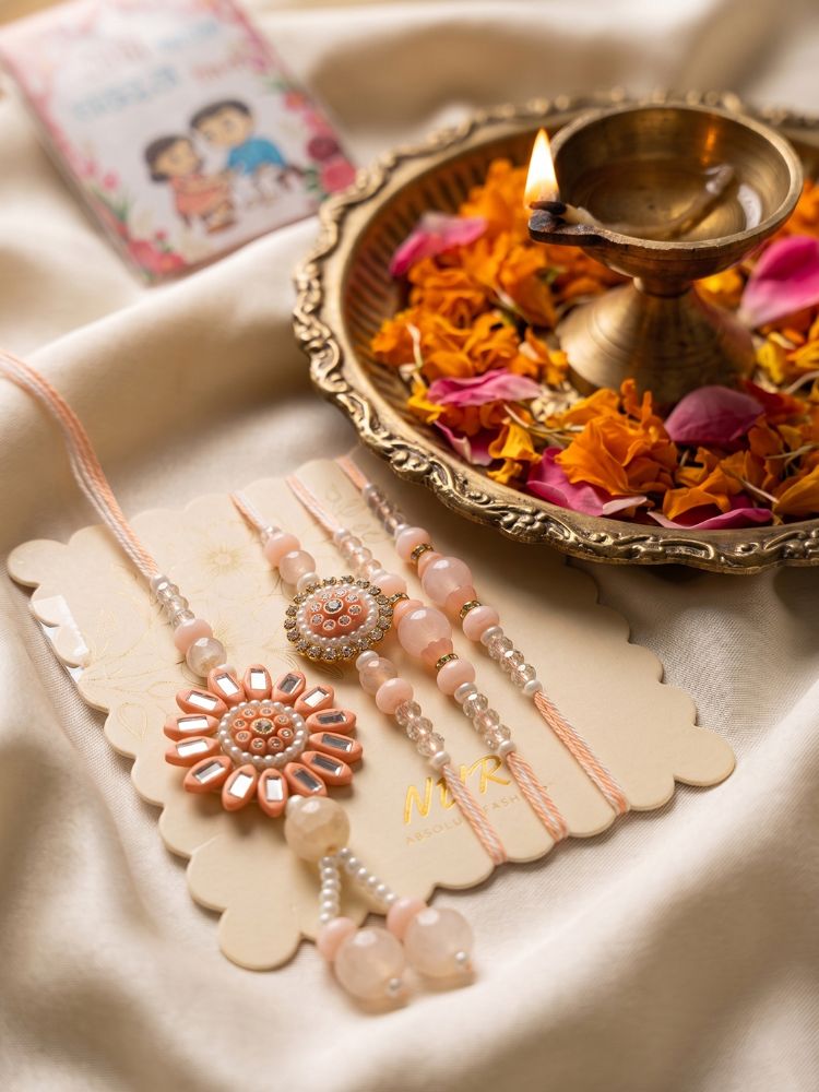 NVR Set of 4 Beaded Family Pack Thread Rakhi with Roli Chawal Chandan Mishri | Grocsy