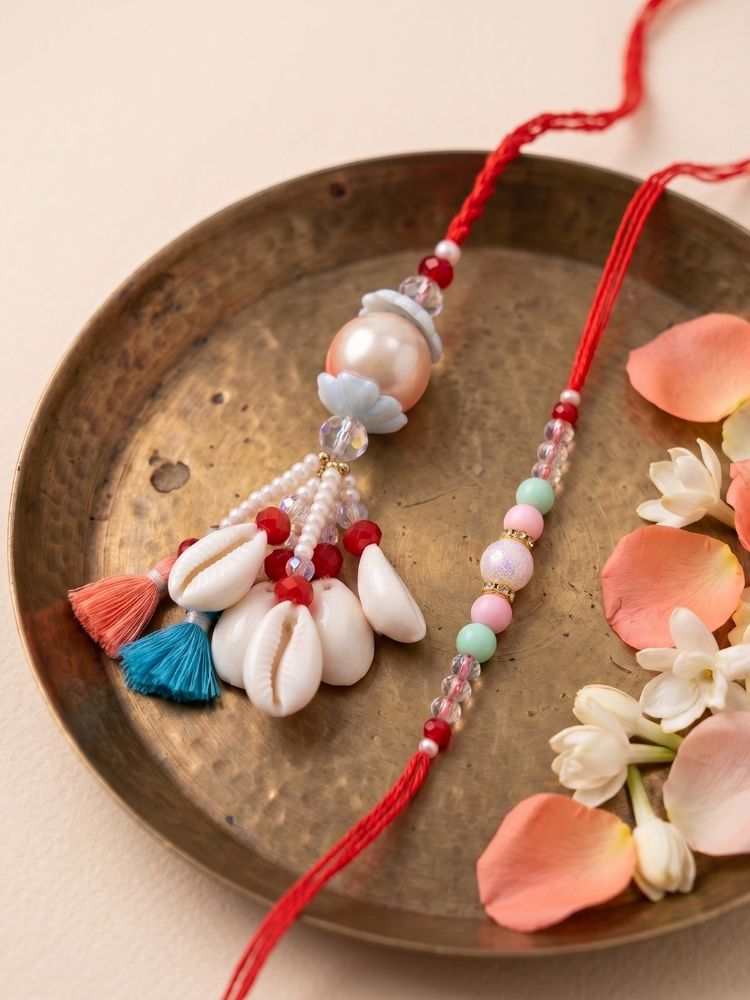 NVR Set of 2 Multicolor Artificial Beads & Sea Shell Bhaiya Bhabhi Rakhi with Roli Chawal | Grocsy