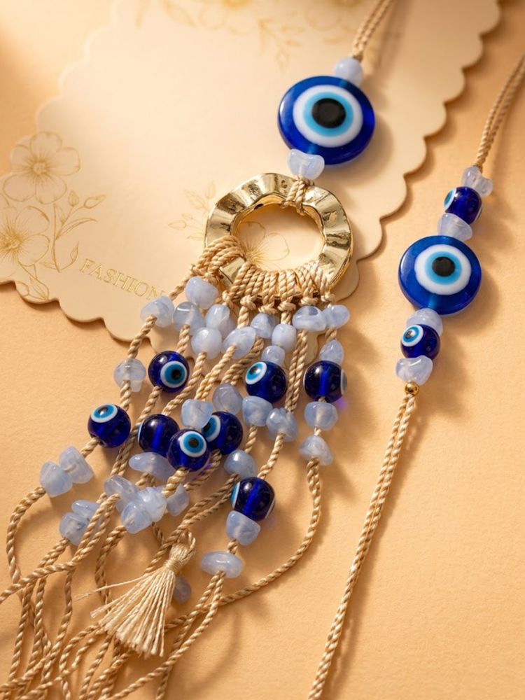 NVR Set of 2 Gold Toned Round Evil Eye Bhaiya Bhabhi Rakhi with Roli Chawal Chandan Mishri | Grocsy