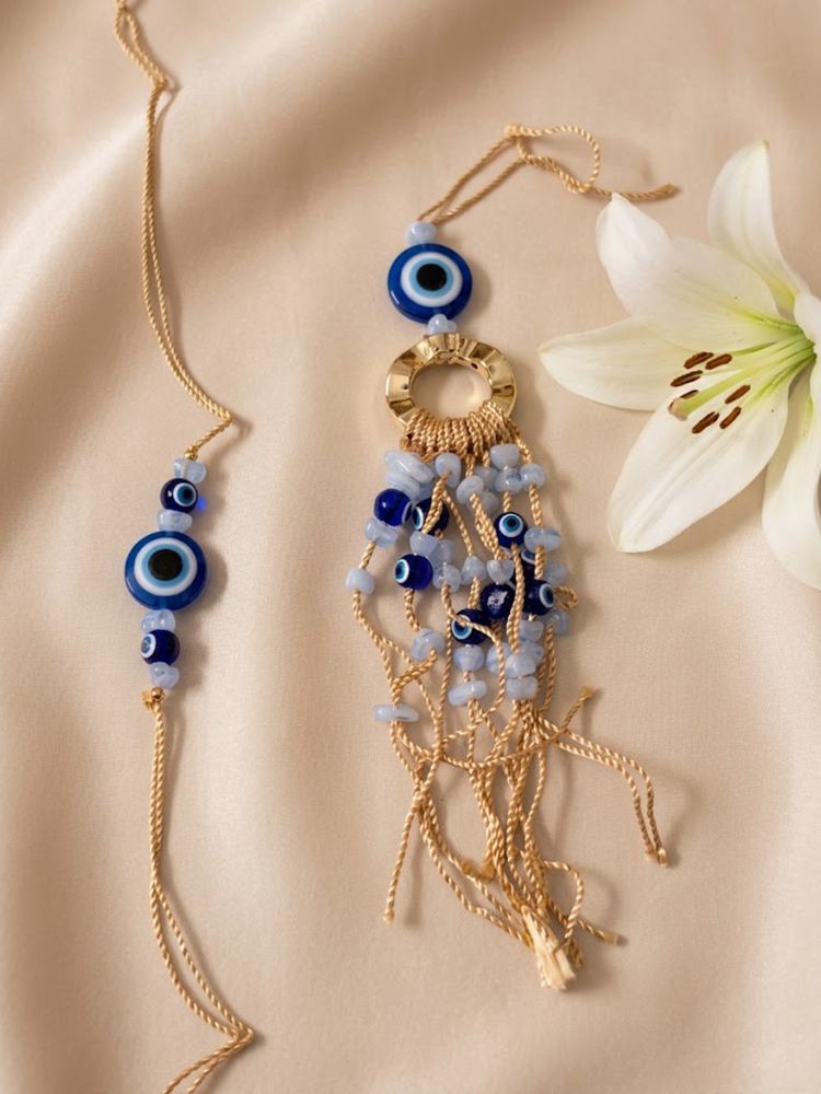 NVR Set of 2 Gold Toned Round Evil Eye Bhaiya Bhabhi Rakhi with Roli Chawal Chandan Mishri | Grocsy