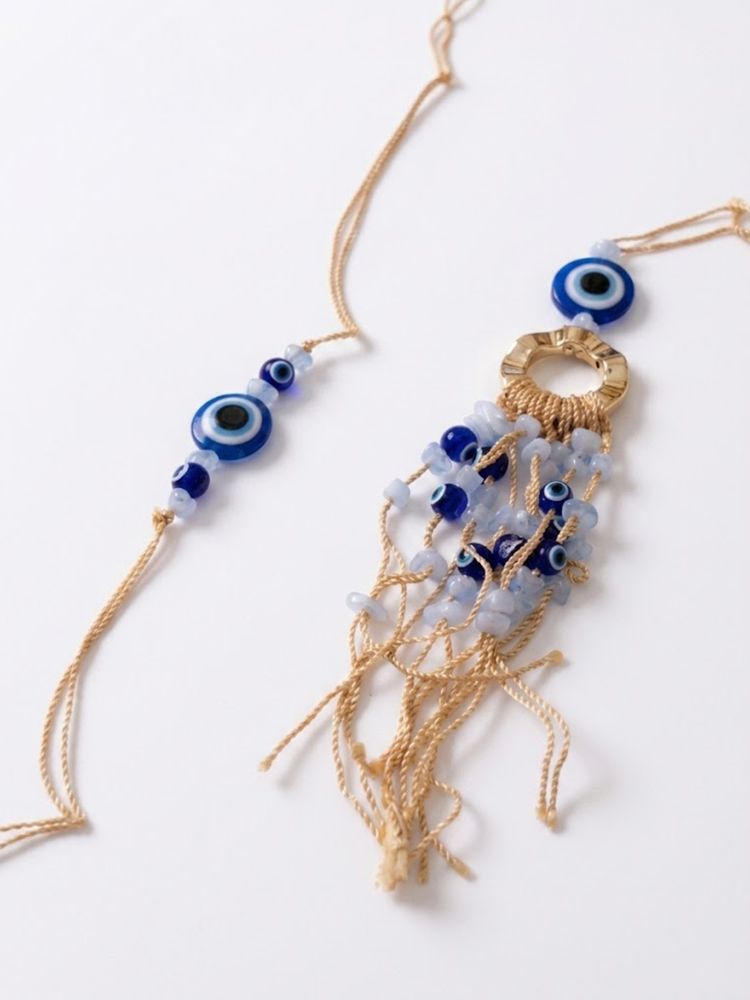 NVR Set of 2 Gold Toned Round Evil Eye Bhaiya Bhabhi Rakhi with Roli Chawal Chandan Mishri | Grocsy