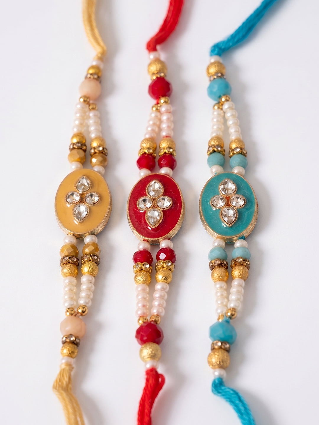NVR Set of 3 Multicolor Artificial Beads & White Pearls Thread Rakhi with Roli Chawal | Grocsy