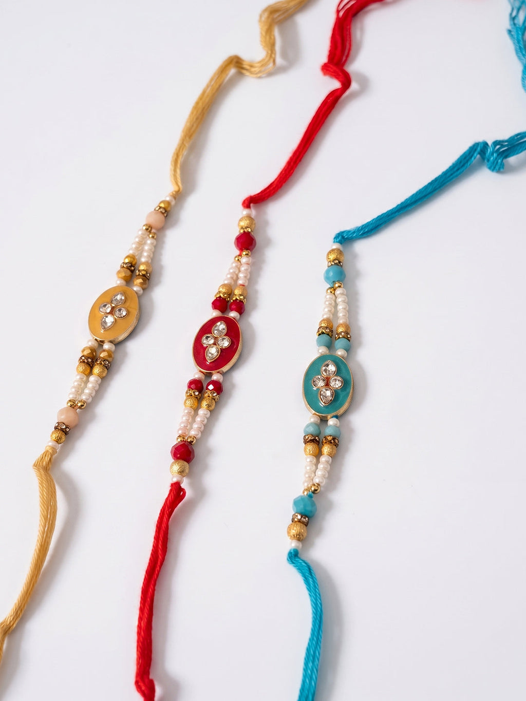 NVR Set of 3 Multicolor Artificial Beads & White Pearls Thread Rakhi with Roli Chawal | Grocsy