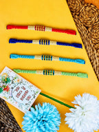 NVR Set of 4 Multicolor Artificial Beads Thread Rakhi with Roli Chawal Chandan Mishri | Grocsy