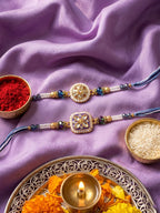 NVR Set of 2 White Pearls Thread Rakhi with Roli Chawal Chandan Mishri | Grocsy