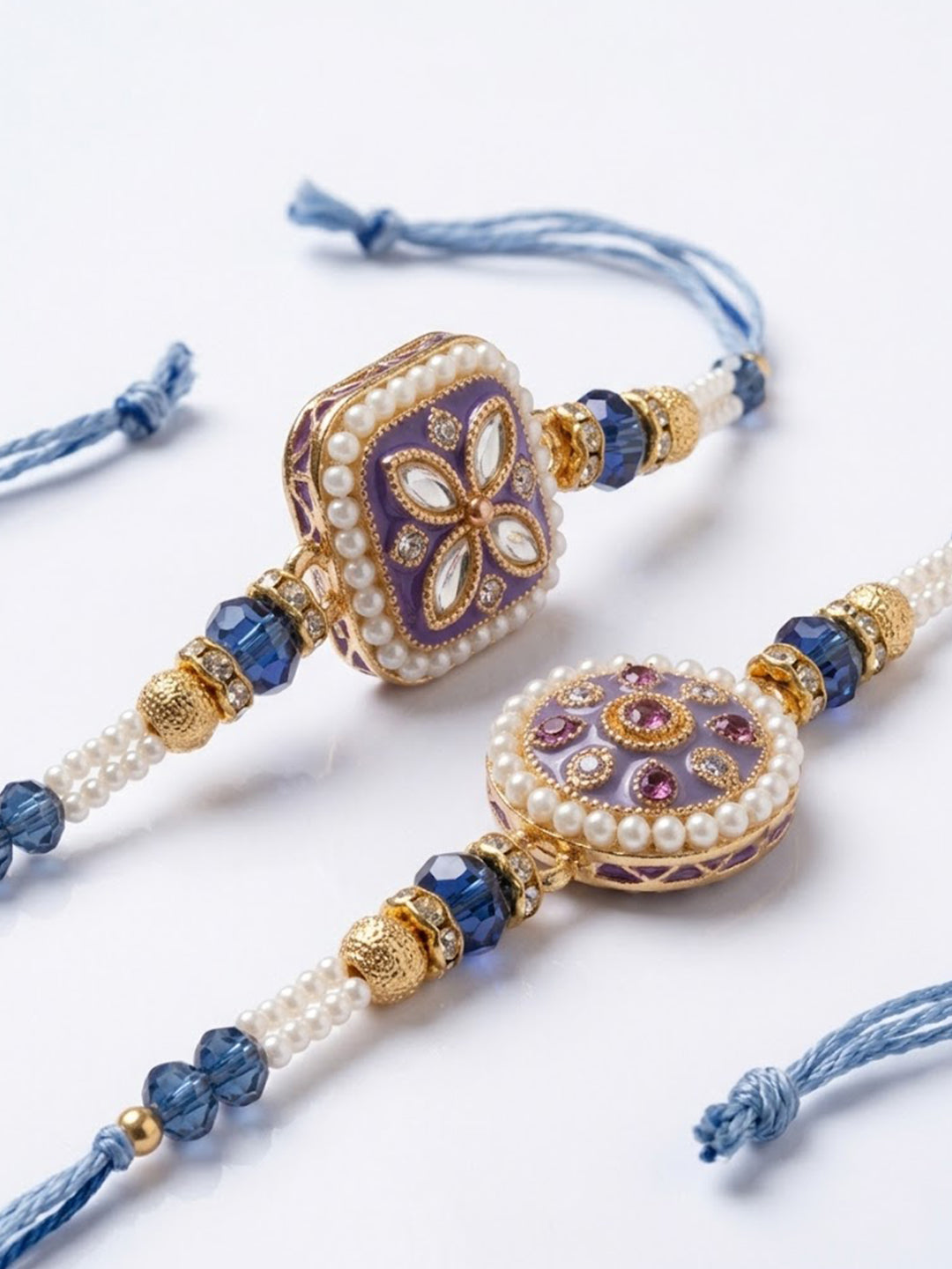 NVR Set of 2 White Pearls Thread Rakhi with Roli Chawal Chandan Mishri | Grocsy