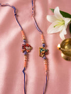 NVR Set of 2 Krishna Ji & Ganesh Ji Beaded Religious Thread Rakhi with Roli Chawal | Grocsy