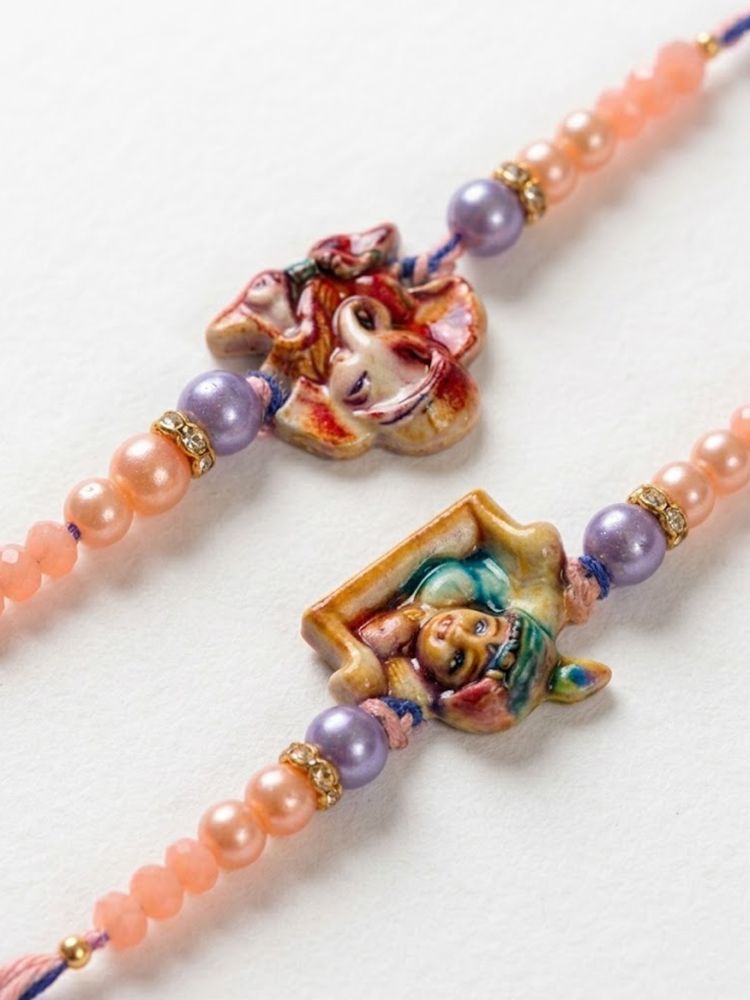 NVR Set of 2 Krishna Ji & Ganesh Ji Beaded Religious Thread Rakhi with Roli Chawal | Grocsy