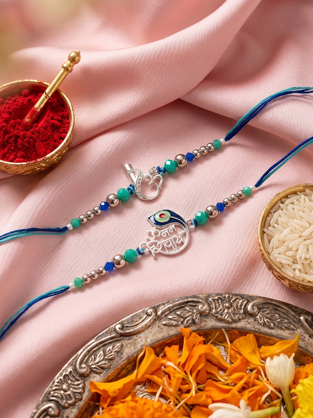 NVR Set of 2 Silver Toned Beaded Religious Thread Rakhi with Roli Chawal Chandan Mishri | Grocsy