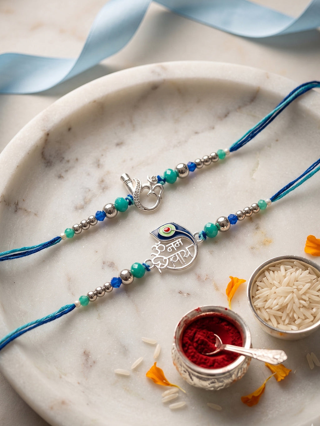 NVR Set of 2 Silver Toned Beaded Religious Thread Rakhi with Roli Chawal Chandan Mishri | Grocsy