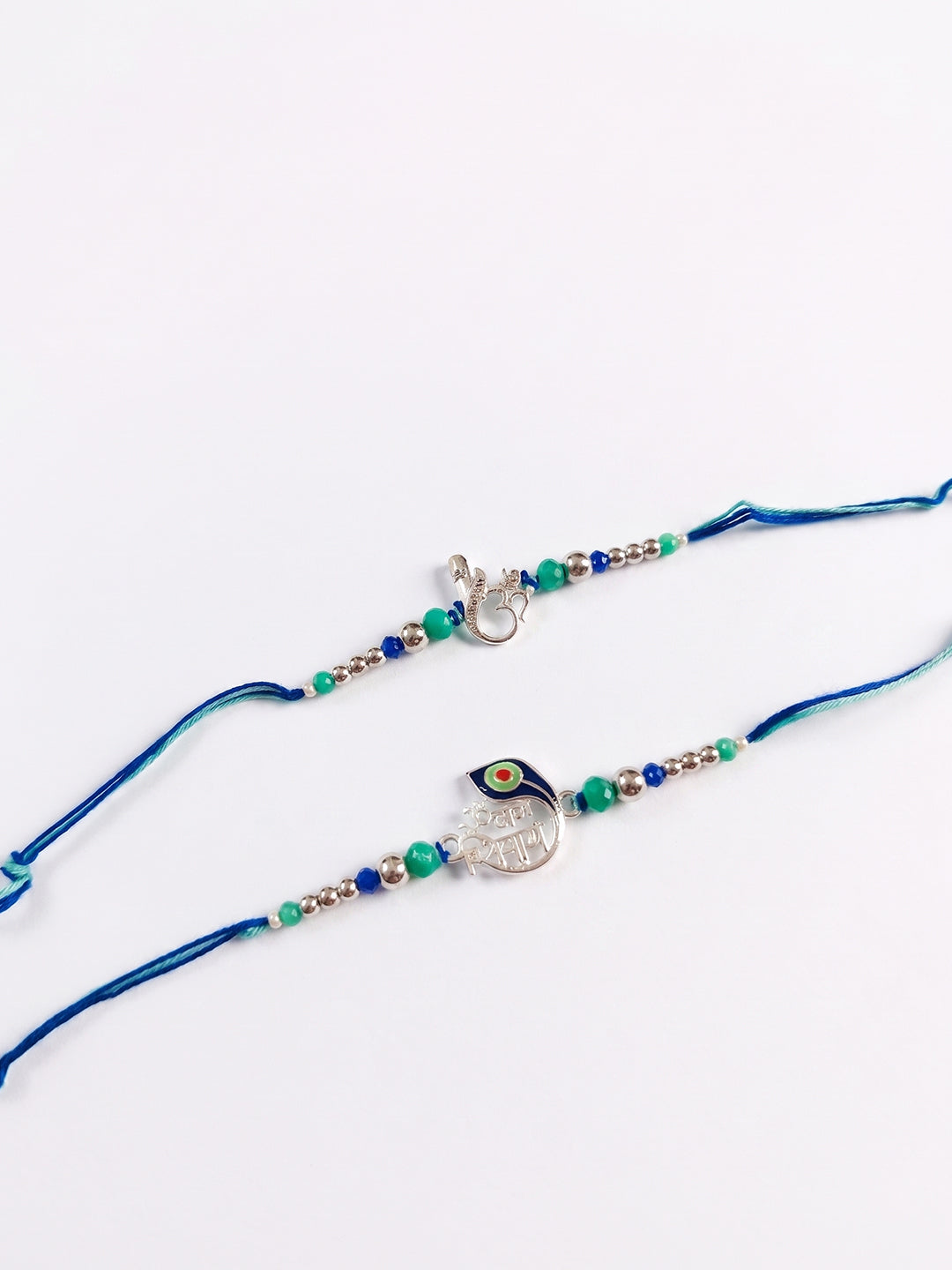 NVR Set of 2 Silver Toned Beaded Religious Thread Rakhi with Roli Chawal Chandan Mishri | Grocsy