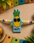 NVR Pineapple Design Kids Thread Rakhi with Roli Chawal Chandan Mishri | Grocsy