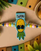 NVR Pineapple Design Kids Thread Rakhi with Roli Chawal Chandan Mishri | Grocsy