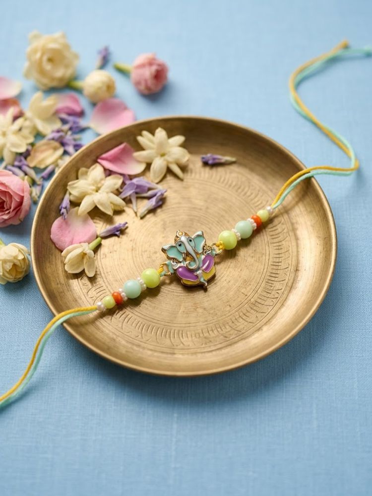 NVR Multicolor Artificial Beads Ganesh Ji Thread Rakhi With Roli Chawal Chandan Mishri | Grocsy