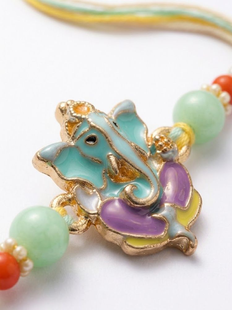 NVR Multicolor Artificial Beads Ganesh Ji Thread Rakhi With Roli Chawal Chandan Mishri | Grocsy