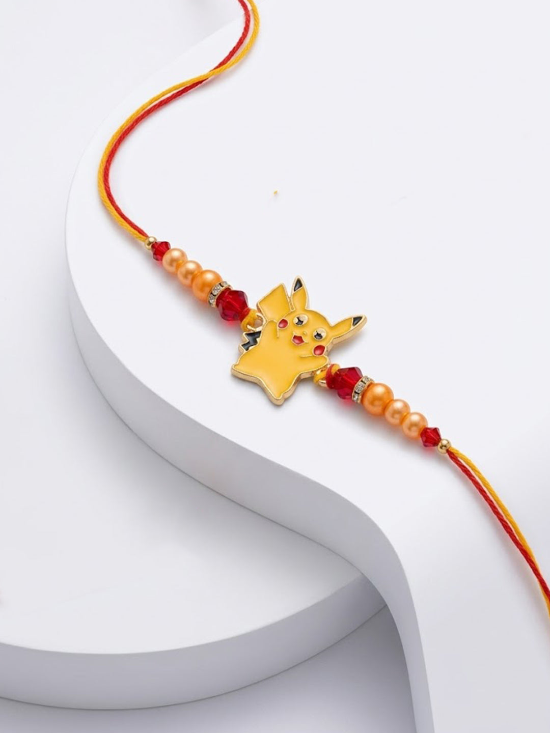 NVR Kids Pikachu Pokemon Cartoon Yellow & Red Thread Rakhi with Roli Chawal Chandan Mishri | Grocsy