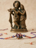 NVR Radha Krishna Multicolor Artificial Beads Thread Rakhi With Roli Chawal Chandan Mishri | Grocsy