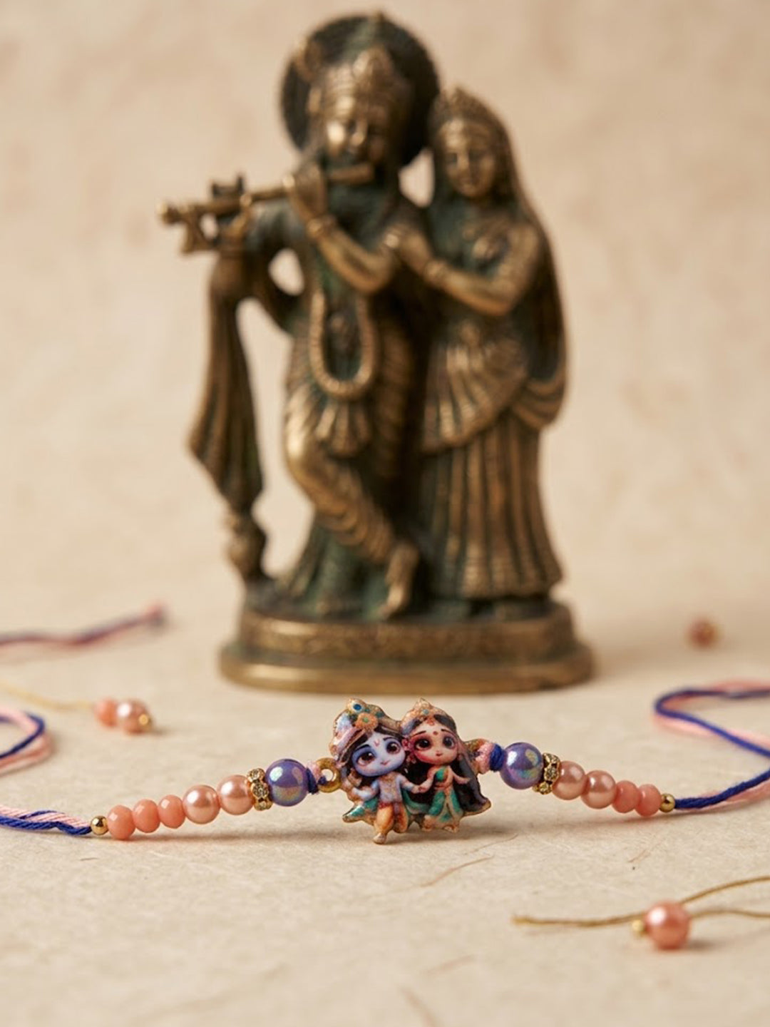NVR Radha Krishna Multicolor Artificial Beads Thread Rakhi With Roli Chawal Chandan Mishri | Grocsy