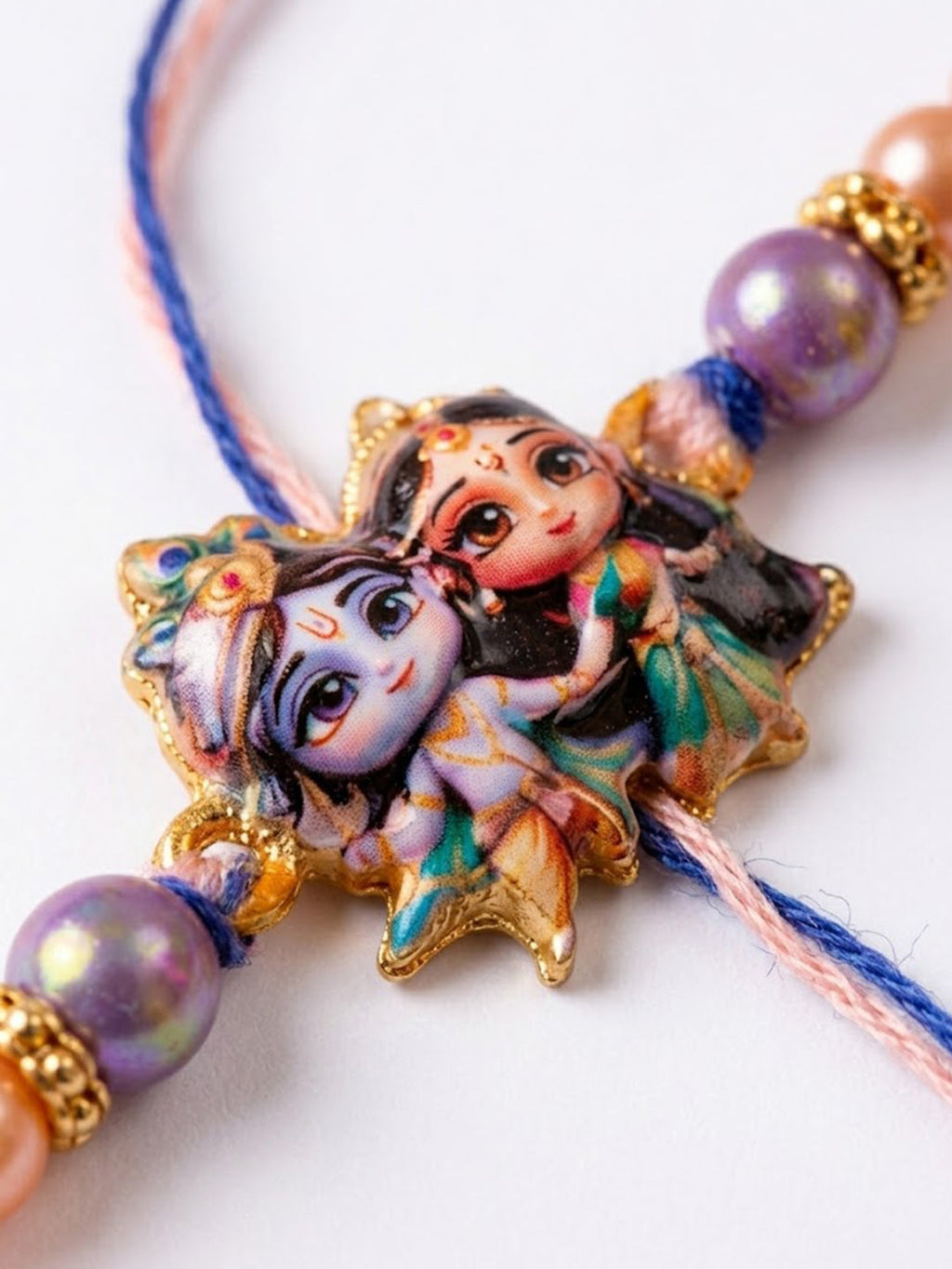 NVR Radha Krishna Multicolor Artificial Beads Thread Rakhi With Roli Chawal Chandan Mishri | Grocsy