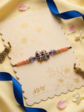 NVR Radha Krishna Multicolor Artificial Beads Thread Rakhi With Roli Chawal Chandan Mishri | Grocsy