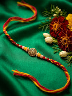 NVR Artificial Beads Decorative Om Design Religious Thread Rakhi with Roli Chawal Chandan | Grocsy