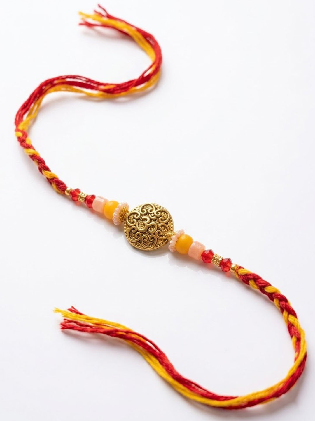 NVR Artificial Beads Decorative Om Design Religious Thread Rakhi with Roli Chawal Chandan | Grocsy