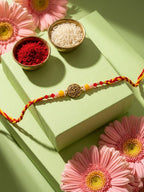 NVR Artificial Beads Decorative Om Design Religious Thread Rakhi with Roli Chawal Chandan | Grocsy