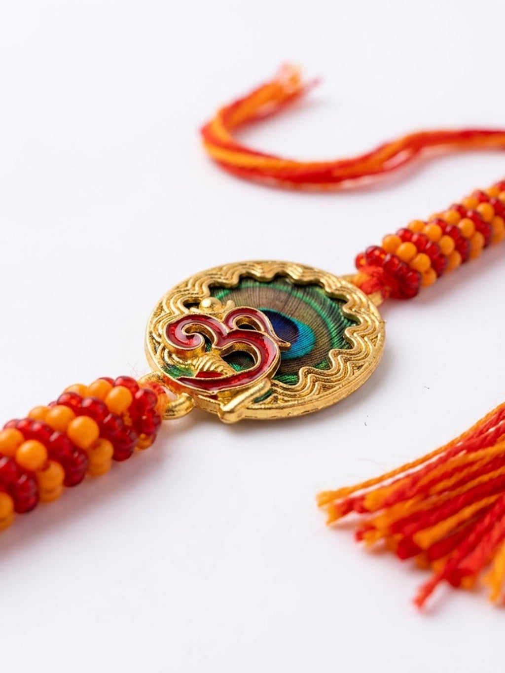 NVR Om Motif Divine Religious Thread Rakhi with Roli Chawal Chandan Mishri | Grocsy